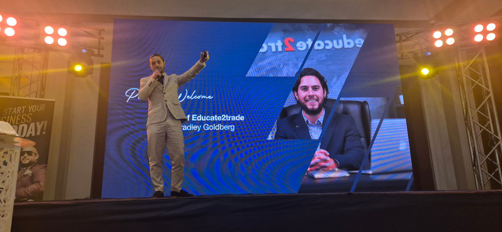 Bradley Goldberg speaking on stage at an Educate2Trade event in Egypt