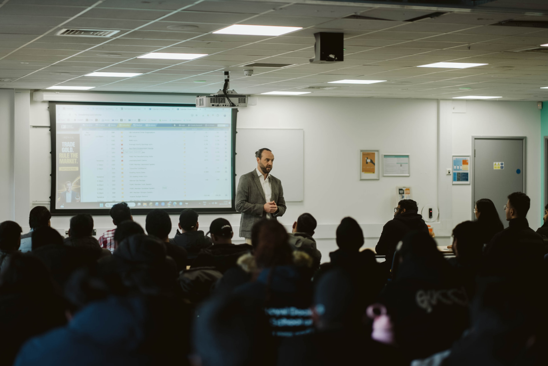 Educate2Trade mentor presenting live market data to UEL students