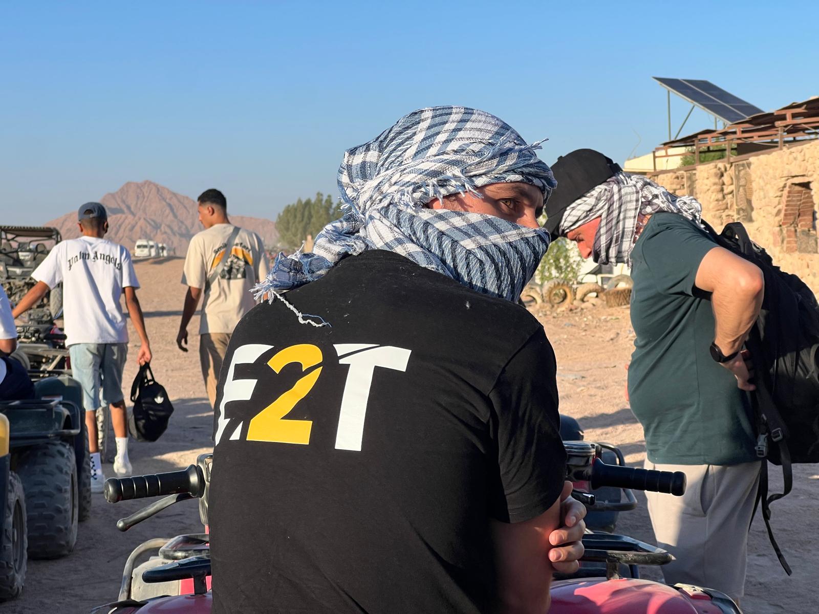 Educate2Trade team member on a quad bike in the Egyptian desert